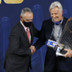 MLB Commissioner Rob Manfred presents the Commissioner’s Trophy to owner Mark Walter of the Los Angeles Dodgers Tuesday night.